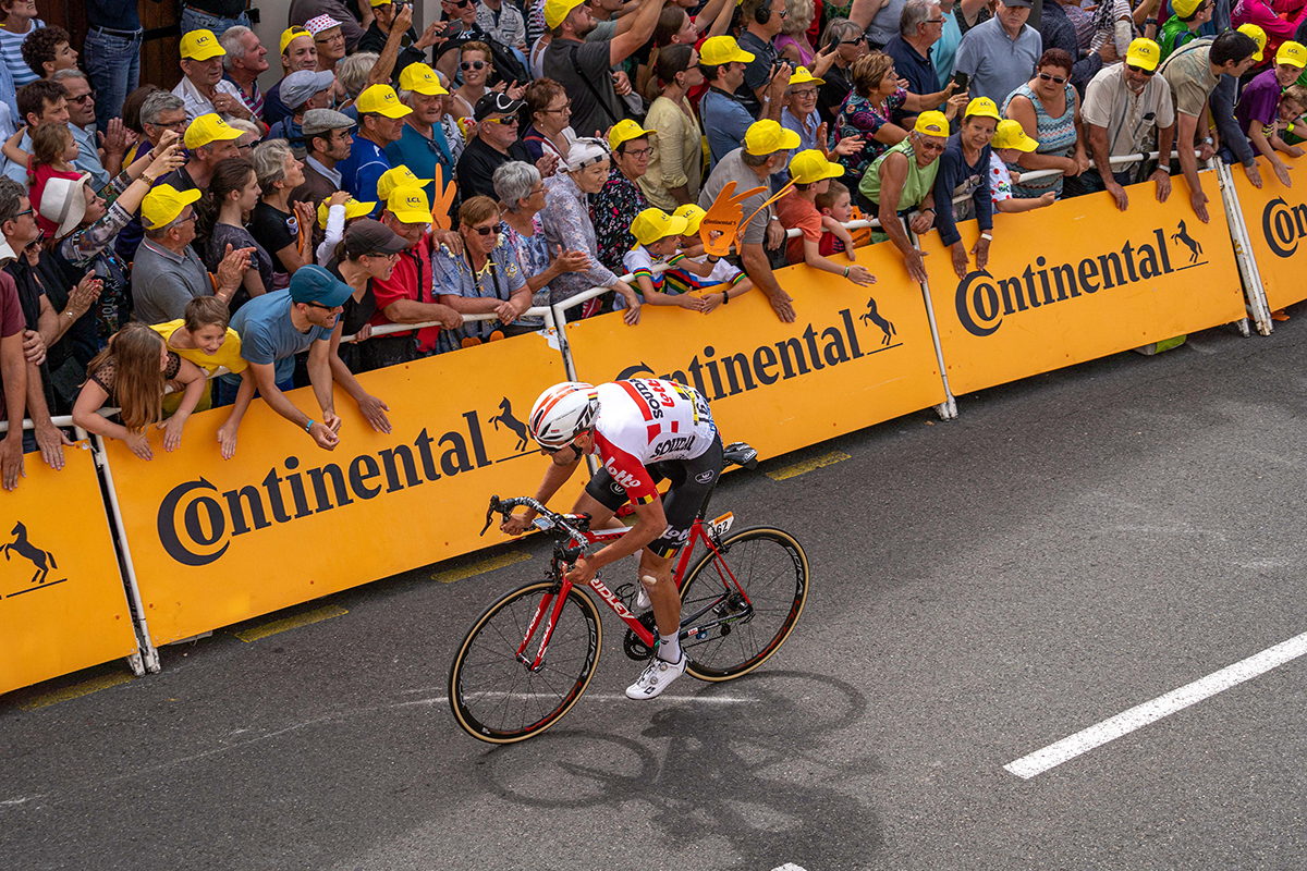 Thomas De Gendt's team mate Tiesj Benoot drills it for the finish