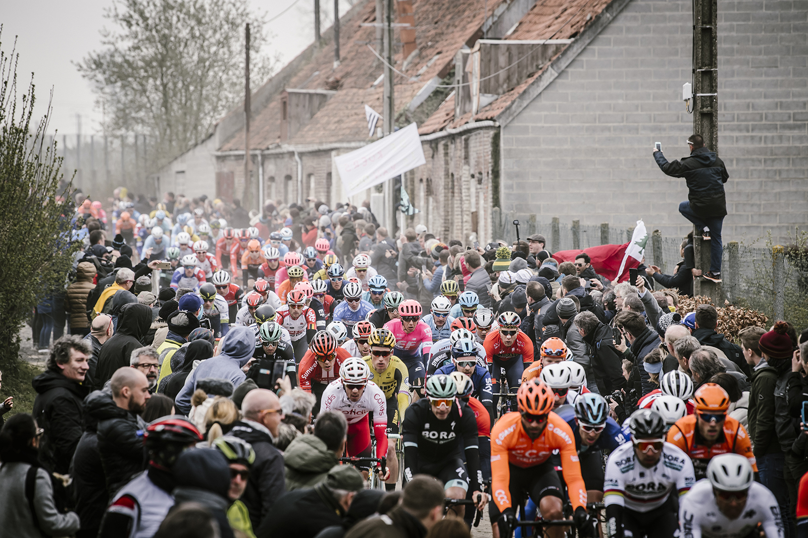 The Pelotan squeeze past fans at Paris - Roubaix